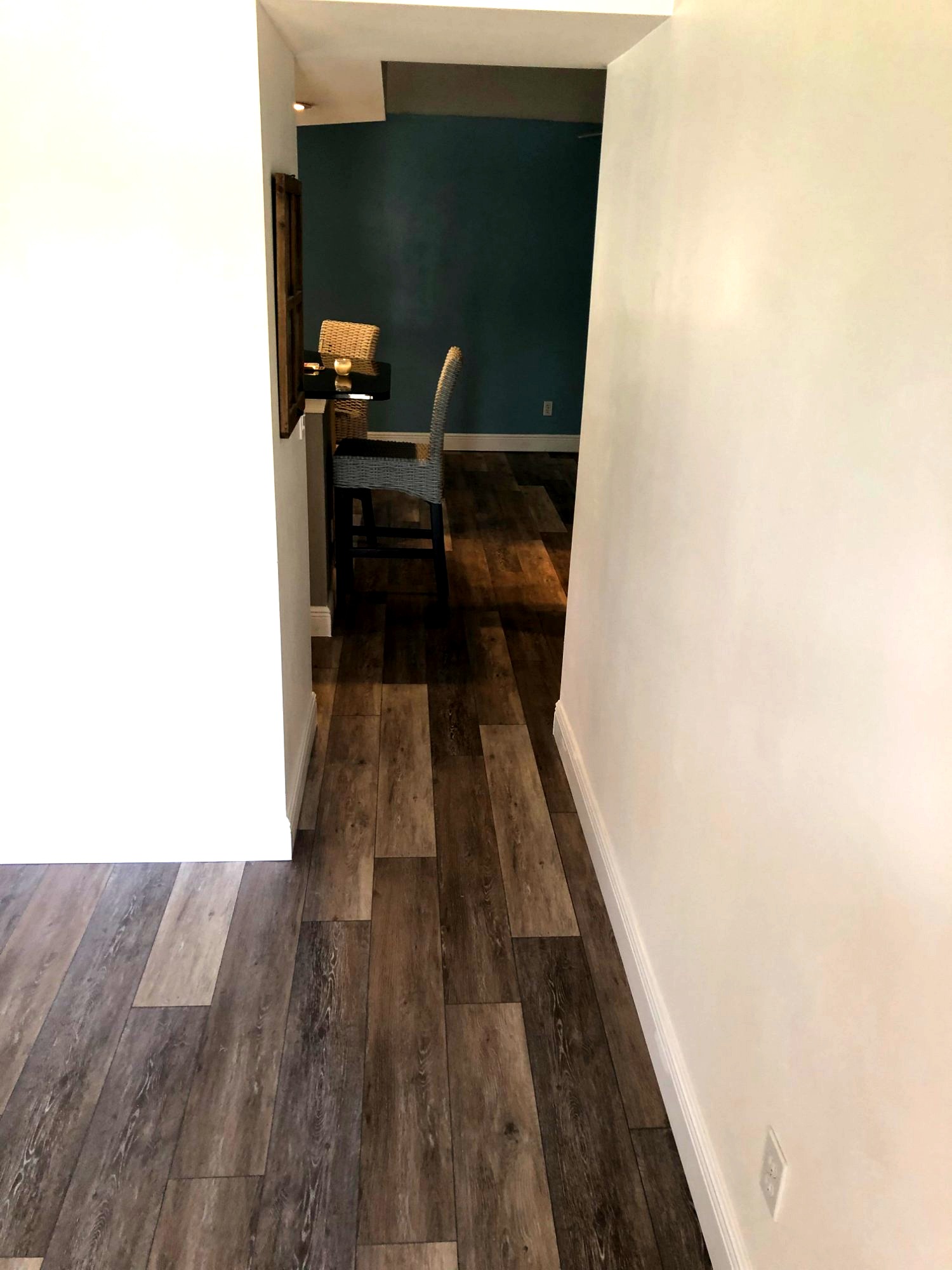 Dark LVP flooring hallway installation